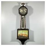 NEW HAVEN CLOCK CO. BANJO CLOCK | Crested by an eagle finial, octagonal face, brushed metal with Rom