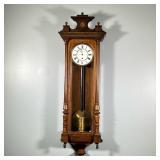 REGULATOR WALL CLOCK | White face with Roman numeral markers, with an engraved brass weight. - h. 45
