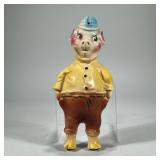 PIG-FORM PIGGY BANK | Glazed ceramic dressed pig-form piggy bank, mounts on the wall, marked on back