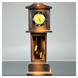 INGRAHAM POCKET WATCH & SAFE | Paint decorated enameled pocket watch case, in a grandfather clock-fo