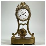 BRASS SHELF CLOCK | Gilt brass frame with acanthus scroll and shell crest, rose pattern surrounding 