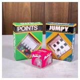 (3pc) Vintage Toys | Including a Slinky Jr., a Jumpy puzzle, and a Points puzzle by Reiss. - h. 5.75