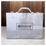 Rockwell Electric Drill | In a metal carrying case, and with various drill bits. - h. 11.5 x w. 13.5