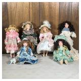 (6pc) Fancy Porcelain Dolls | Including a Caldor Early Blossom Collection porcelain doll, a doll in 