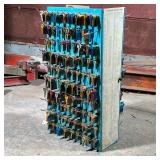 Curtis Industries Metal Key Rack | Filled with brass and anodized key blanks. - h. 26 x w. 14 x d. 1