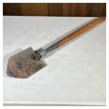 Vintage Pack Shovel | Wood handle, the shovel marked “US WOOD”. - w. 6 x l. 32 in