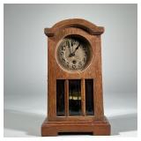MISSION-STYLE OAK SHELF CLOCK | Likely German, having an oak case with hinged front door with three 