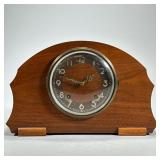 PLYMOUTH SHELF CLOCK | The Plymouth Clock, Thomaston, Conn., in a curved wood case, with Guarantee a
