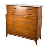HENDREDON MID-CENTURY TALL CHEST | Mid-century modern dresser having four half-drawers over three fu
