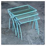 CAST IRON PATIO NESTING TABLES | A set of three glass top side tables with blue cast iron frames and
