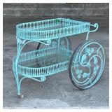 MID-CENTURY PATIO BAR CART | Cast iron bar cart with two glass shelves, having scrollwork and intric