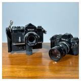 (2pc) Nikon 35mm Cameras | Nikon SLR film cameras including a Nikon N2000 and a Nikon on a Polaroid 