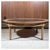Round Mid-century Coffee Table | Low table with a black inset top in a wood frame. - h. 14.5 x dia. 