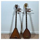 (2pc) Decorative Instruments | With decorative figural finials. - l. 34 in (longest)