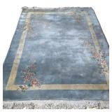 BLUE RUG | With floral sprays on a plain light blue ground with cream border. - w. 65 x l. 107 in