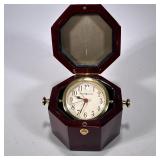 HOWARD MILLER OCTAGONAL WOOD BOX CLOCK | Model 645-187, in a nicely figured wooden box - h. 4 x w. 7