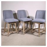 (3pc) SWIVEL ROUND BACK STOOLS | Set of three round back upholstered swiveling bar stools on wood ba