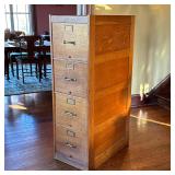 GLOBE GOLDEN OAK FILING CABINET | Having four drawers - h. 52.5 x w. 16.5 x d. 28 in. in