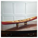 MODEL CANOE | Red painted model canoe with removable seats & two paddles on a wood stand - h. 6 x w.
