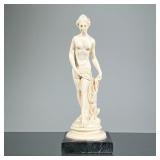 CLASSICAL SCULPTURE | Ceramic sculpture of a nude woman in a classical style mounted on a black marb