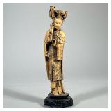 CARVED ASIAN FIGURE | Faux bone carved Asian figure depicting woman playing an instrument on carved 