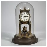 GUSTAV BECKER DOMED CLOCK | Glass domed German brass clock marked on back "Gustav Becker" - h. 8 x d