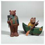 (2pc) OUTDOORS CARVED BEARS | Pair of outdoorsy carved wood bears including canoeing bear and lumber