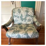 Low Armchair with Green Upholstery | Low to the ground armchair with wide arms, curved back and gree