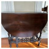 Drop-Leaf Round Table | Antique English Jacobean style drop-leaf table with a 48" diameter when open