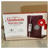 Sunbeam Heating Pad | Sunbeam king-sized heating pad with attached remote control.