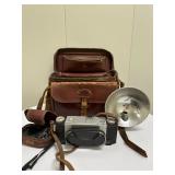 Reelist Camera & Case | Antique "Reelist" camera with leather carrying case.