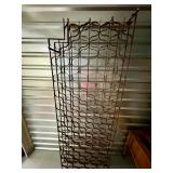 Wine Rack | Large antique wall mount, wrought iron wine rack that holds over 100 bottles in double-s