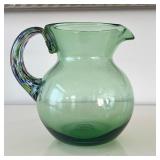 Blown Glass Pitcher | Green blown glass pitcher with colorful art glass handle. - h. 8 x dia. 5.5 in