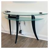 Glass Demilune Table | Modern glass side table with medial shelf, over three splayed legs; n.b. elec