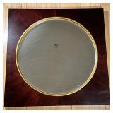 CIRCULAR WALL MIRROR | Large round mirror with gilt border in large square black frame. - h. 42.25 x