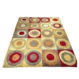 COLORFUL PATTERNED RUG | Colorful circular patterned area rug. - w. 102 x l. 133 in