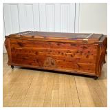 WOODEN CHEST | Carved wood chest with riveted metal hands on top, on wheels. - h. 18 x w. 48 x d. 22
