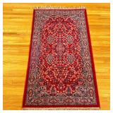 Persian/Sarouk Area Rug (Small) | Persian/Sarouk style area rug in red and navy with white fringe al