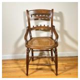 Caned Seat Wooden Chair | Vintage (1950s) carved walnut wooden chair with caned seat. - h. 33 x w. 1