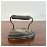 Cast Iron Handheld Iron | Vintage heavyweight cast iron handheld iron, marked "UDX6."