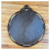 Round Giltwood Mirror | Round giltwood mirror with ornate finial top. - h. 30.5 x d. 1 in