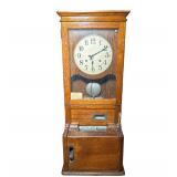 Cincinnati Time Recorder Clock | Cincinnati Ohio, USA, in an oak case, signed face with Arabic numer