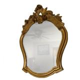 Gilt Carved Mirror | Rococo style gilt mirror with floral and scrollwork decorations. - h. 35.25 x w
