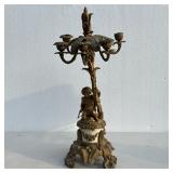 Brass Cupid Candleabra | Brass and stone candelabara with cupid figure at the base over scrolled fol