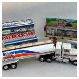 (5pc) Hess & Other Trucks | Including a Permatex toy truck, a Dunkin Donuts tractor-trailer truck, a