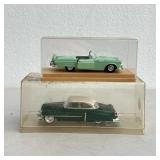 (2pc) Model Cars | Two green model cars in cases. - l. 7 in (Largest case)