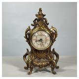 FRENCH STYLE ELECTRIC MANTEL CLOCK | French style gilt mantle clock with scrollowrk case and wall pl
