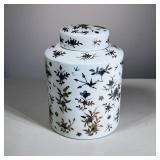 LARGE LIDDED JAR | Large porcelain lidded jar with gilt outlined flowers. - h. 10 x dia. 8 in