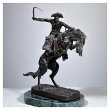 “Broncho Buster” Bronze | Cowboy atop a bucking horse, on a stone platform. Part of the Frederic Rem
