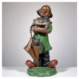“CONTI” BRONZE CLOWN SCULPTURE, PUPPIES | The figure holding a hat and umbrella each with a puppy in